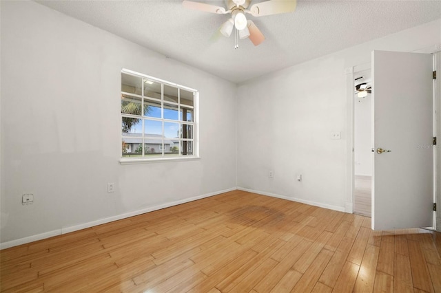 unfurnished room with light hardwood / wood-style floors, a textured ceiling, and ceiling fan