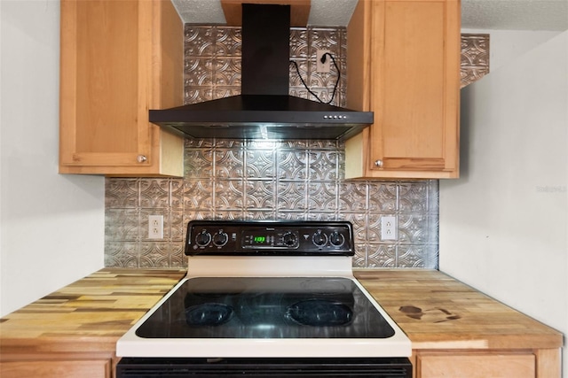 kitchen featuring electric stove, wall chimney range hood, backsplash, and wooden counters