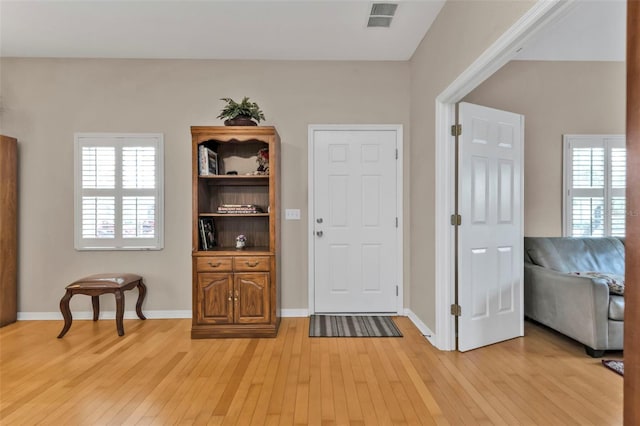 entrance foyer featuring light hardwood / wood-style floors