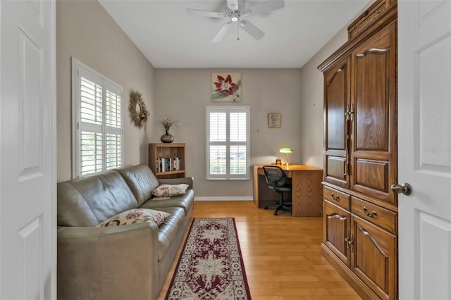 interior space with light hardwood / wood-style floors and ceiling fan