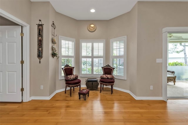 sitting room featuring light hardwood / wood-style flooring