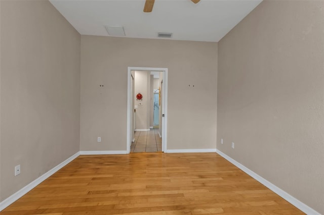 unfurnished room featuring light hardwood / wood-style floors and ceiling fan