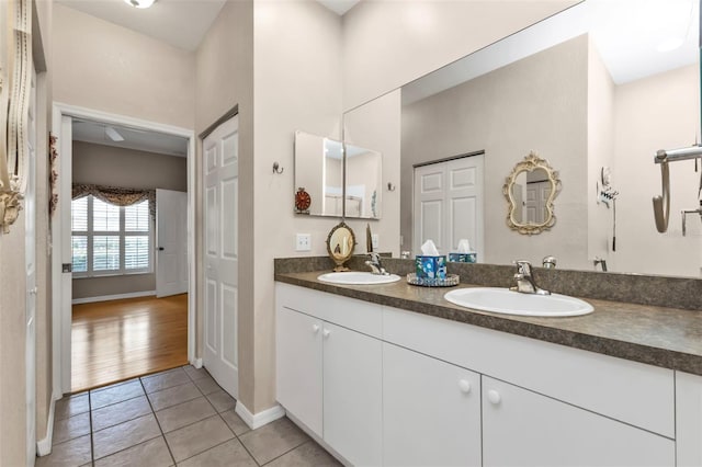 bathroom featuring tile patterned flooring and vanity