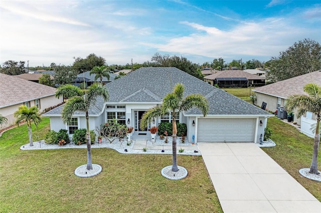 view of front of house with a garage and a front yard