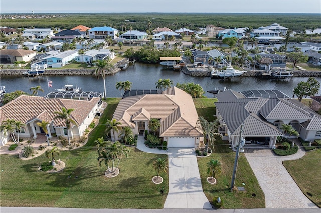 birds eye view of property featuring a water view