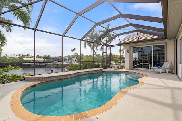 view of swimming pool with a lanai, a water view, and a patio