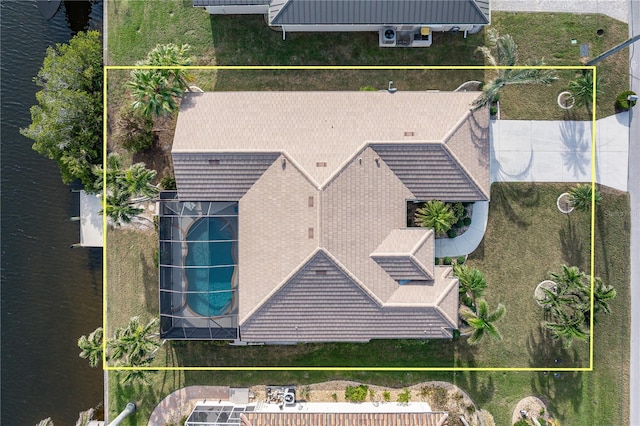 birds eye view of property featuring a water view