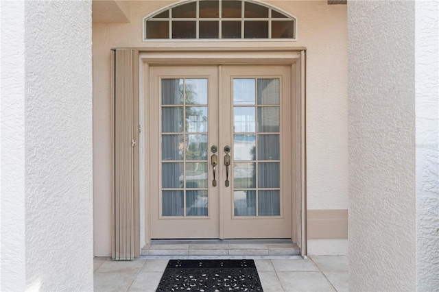 entrance to property featuring french doors