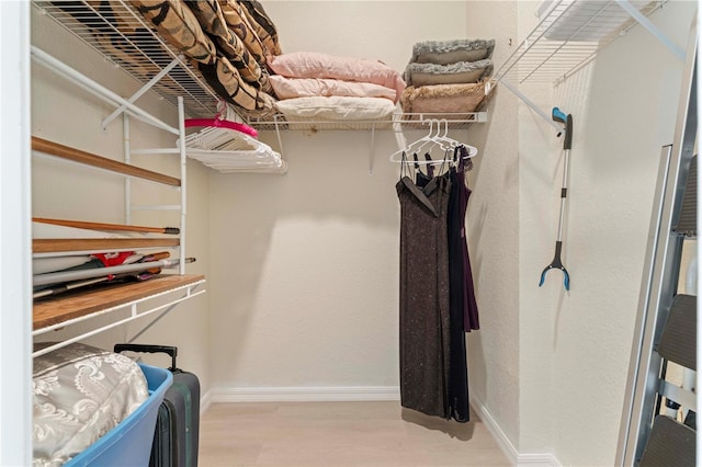 walk in closet featuring light hardwood / wood-style floors