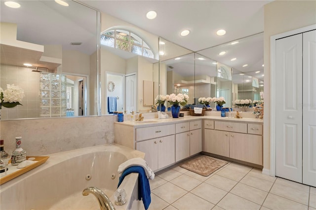 bathroom featuring walk in shower, tile patterned floors, and vanity