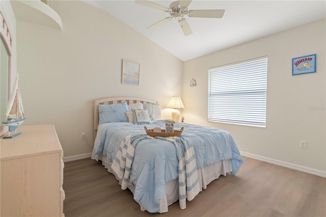 bedroom featuring lofted ceiling, hardwood / wood-style flooring, and ceiling fan