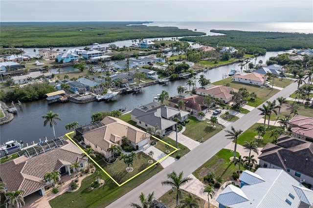 birds eye view of property featuring a water view