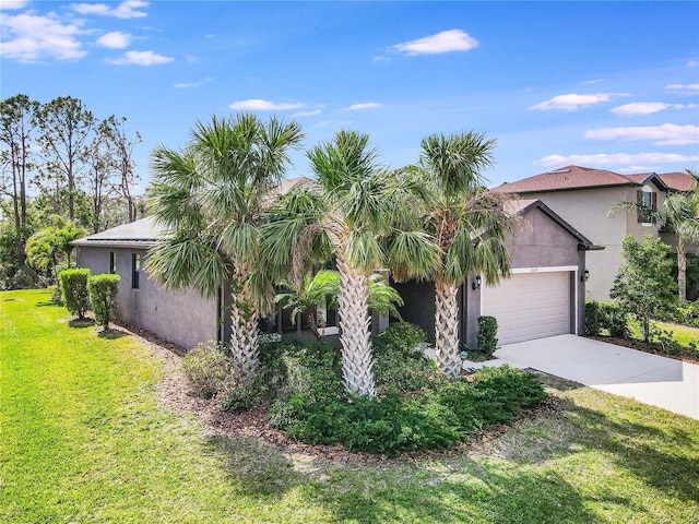 view of front of home featuring a front yard and a garage