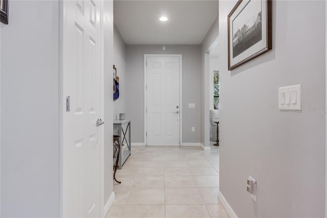 corridor featuring light tile patterned floors