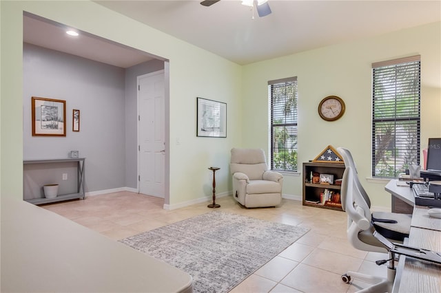 tiled office with plenty of natural light and ceiling fan