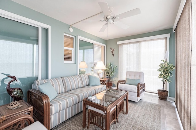 sunroom featuring ceiling fan