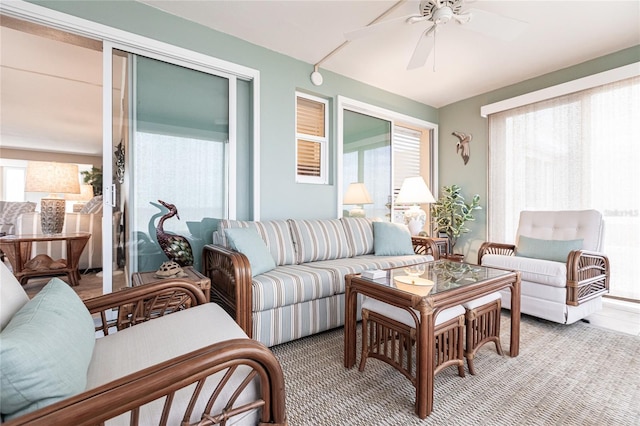 living room featuring carpet and ceiling fan