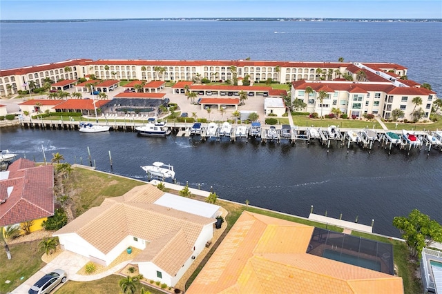 birds eye view of property with a water view