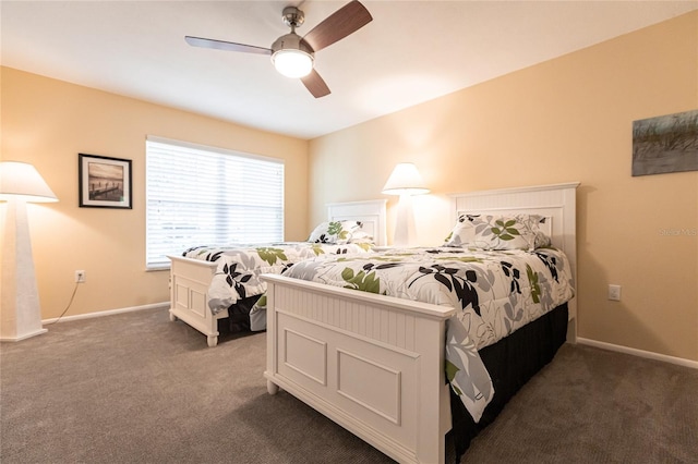 bedroom with ceiling fan and dark carpet