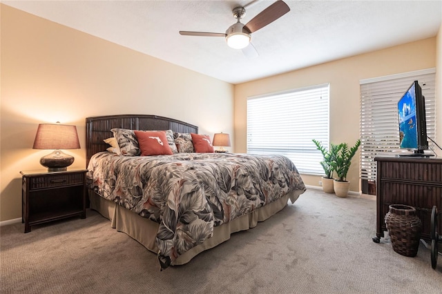 bedroom featuring ceiling fan and light colored carpet