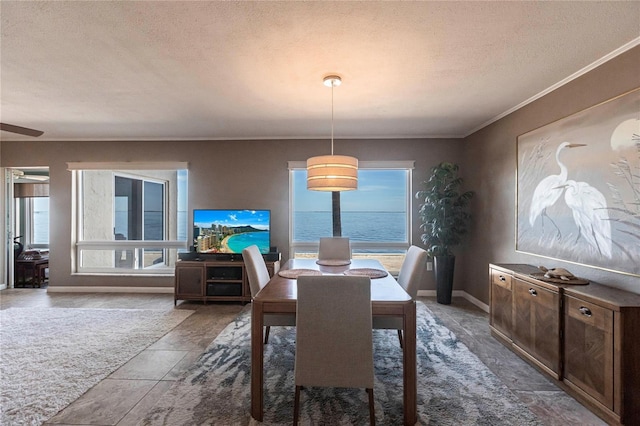 1 Colony Point Dr Unit A19, Punta Gorda, FL 33950 - dining room with a textured ceiling, crown molding, and baseboards