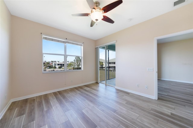 unfurnished room featuring light hardwood / wood-style floors and ceiling fan