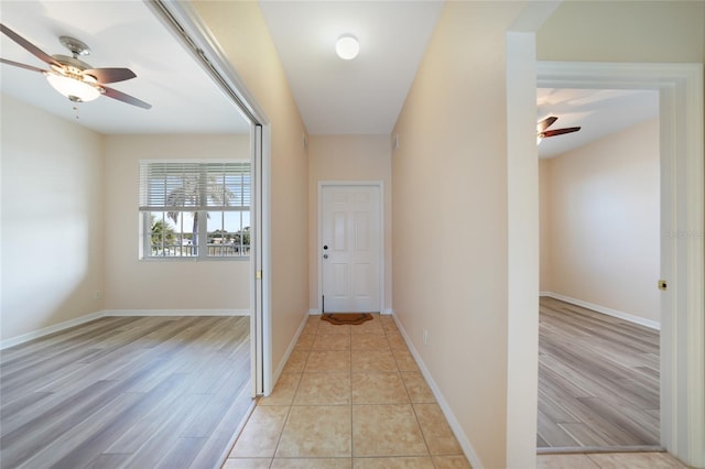 corridor featuring light tile patterned flooring