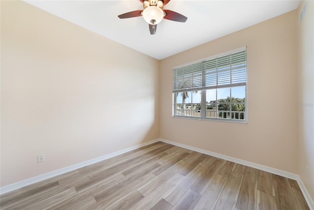 empty room featuring light hardwood / wood-style flooring and ceiling fan