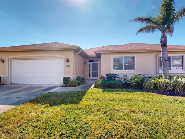 view of front of home with a garage and a front yard