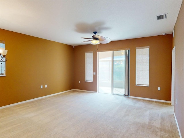 carpeted empty room with ceiling fan