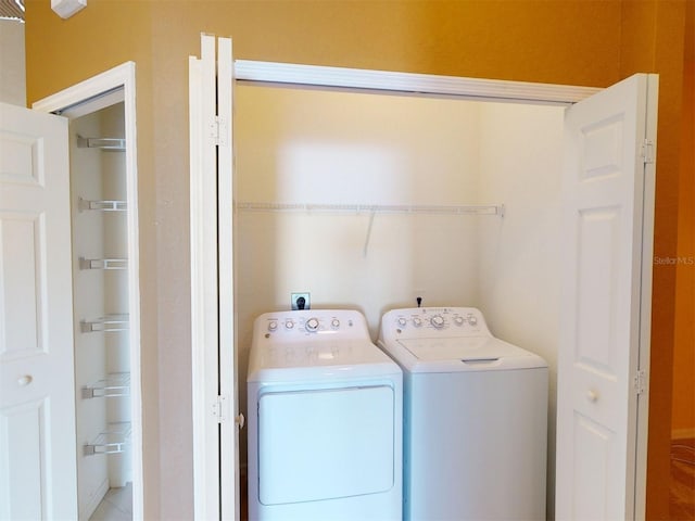 laundry room featuring washing machine and dryer