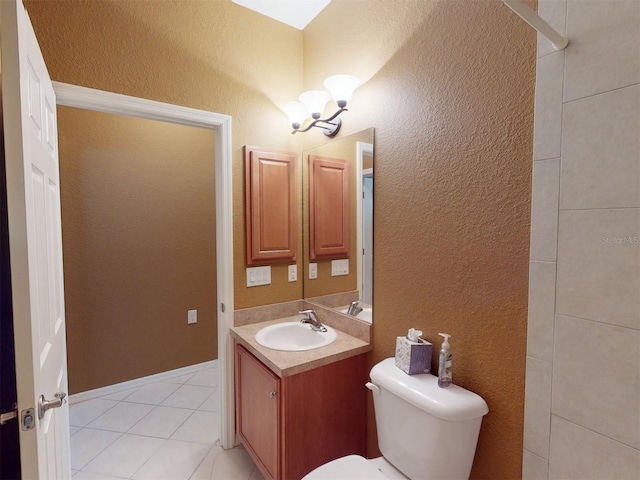 bathroom with vanity, tile patterned floors, an inviting chandelier, and toilet