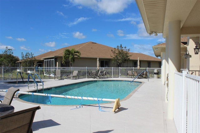 view of swimming pool with a patio