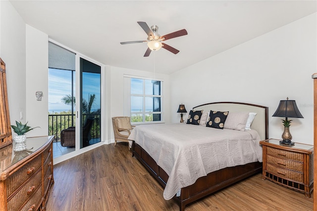 bedroom with hardwood / wood-style flooring, ceiling fan, floor to ceiling windows, and access to outside