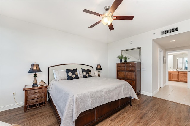 bedroom with hardwood / wood-style floors and ceiling fan