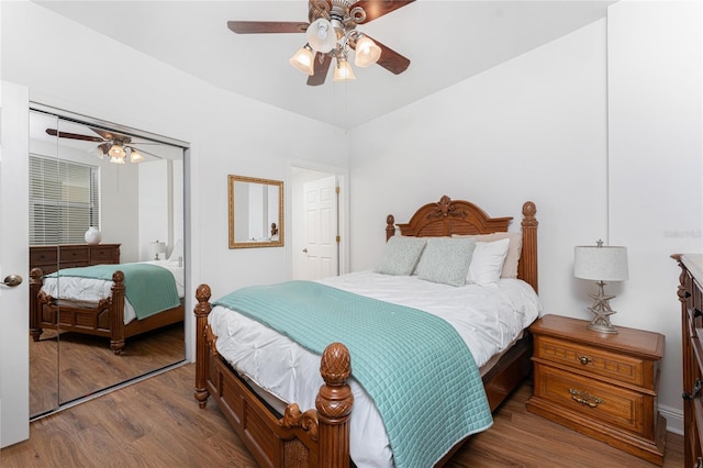 bedroom featuring ceiling fan, wood-type flooring, and a closet