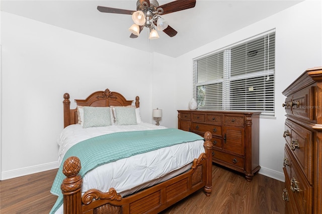 bedroom featuring ceiling fan and dark hardwood / wood-style flooring