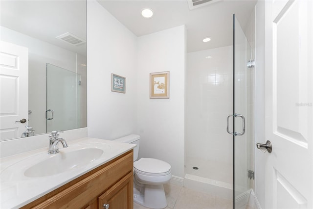 bathroom featuring tile patterned floors, a shower with door, and toilet