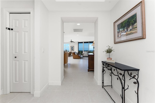 hallway with light tile patterned floors