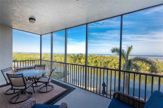 sunroom with a water view