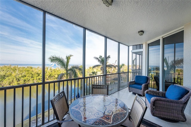 sunroom with a water view