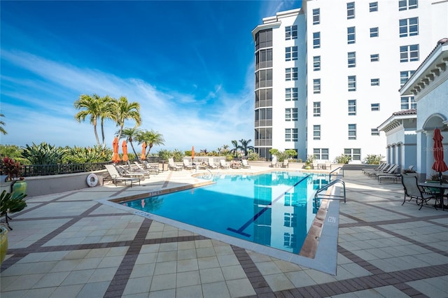 view of swimming pool featuring a patio area