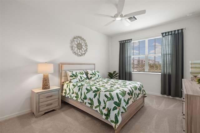 bedroom with light colored carpet and ceiling fan