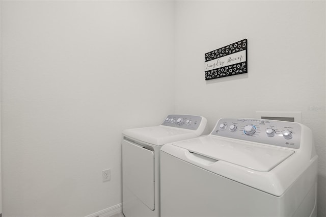 clothes washing area featuring washer and dryer