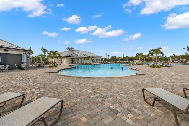 view of swimming pool with a patio area