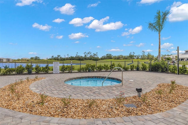 view of pool with a water view and a community hot tub