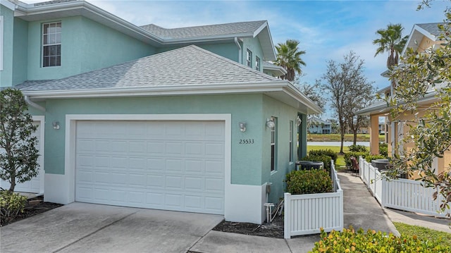 view of side of home with a garage