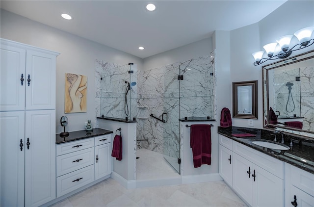 bathroom with an enclosed shower and vanity