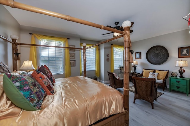 bedroom featuring wood-type flooring and ceiling fan