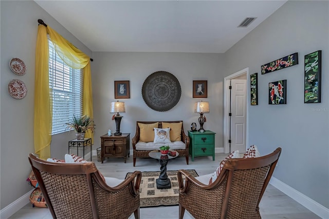 living area with light hardwood / wood-style flooring